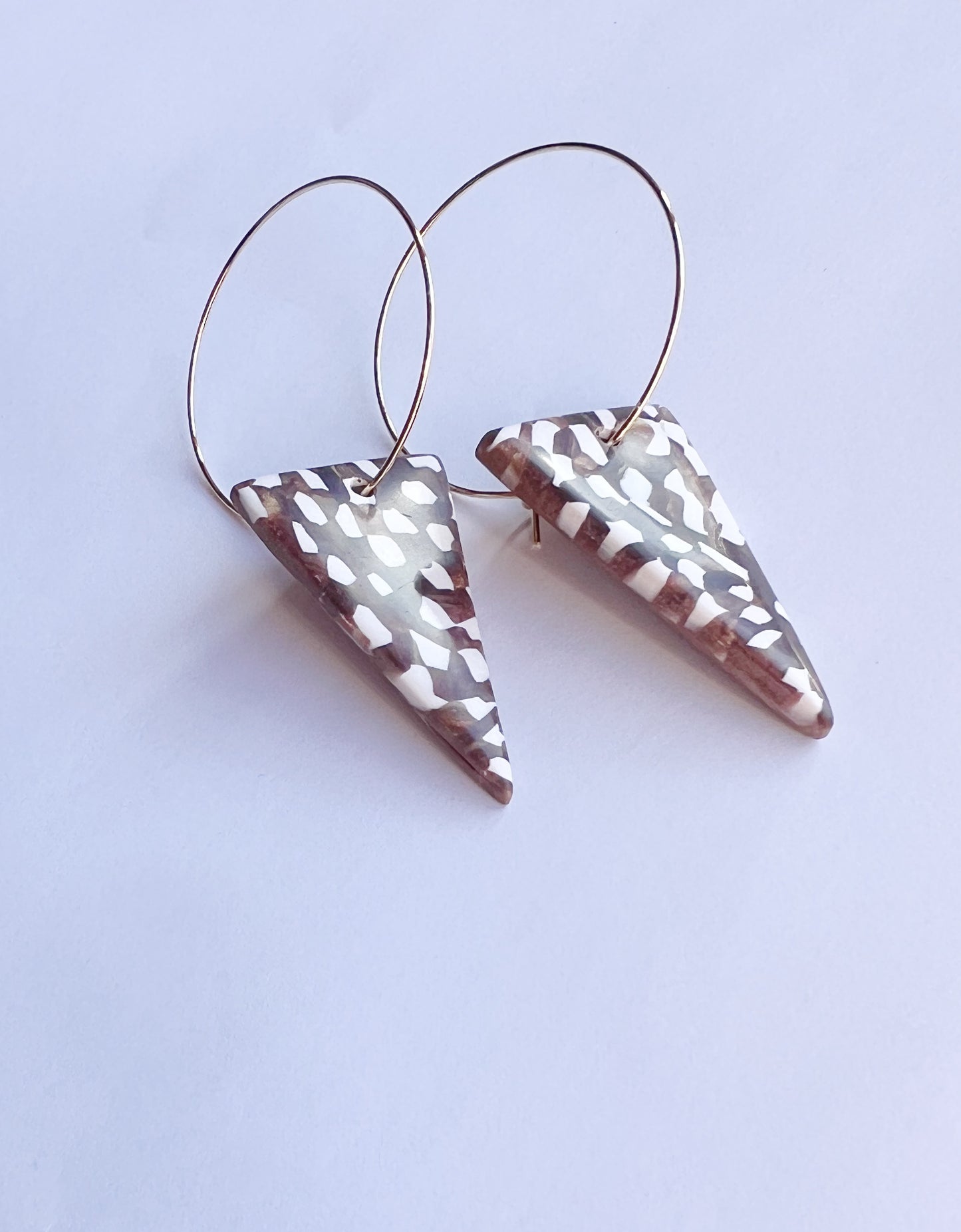 The Taper Earring in bronze and cream