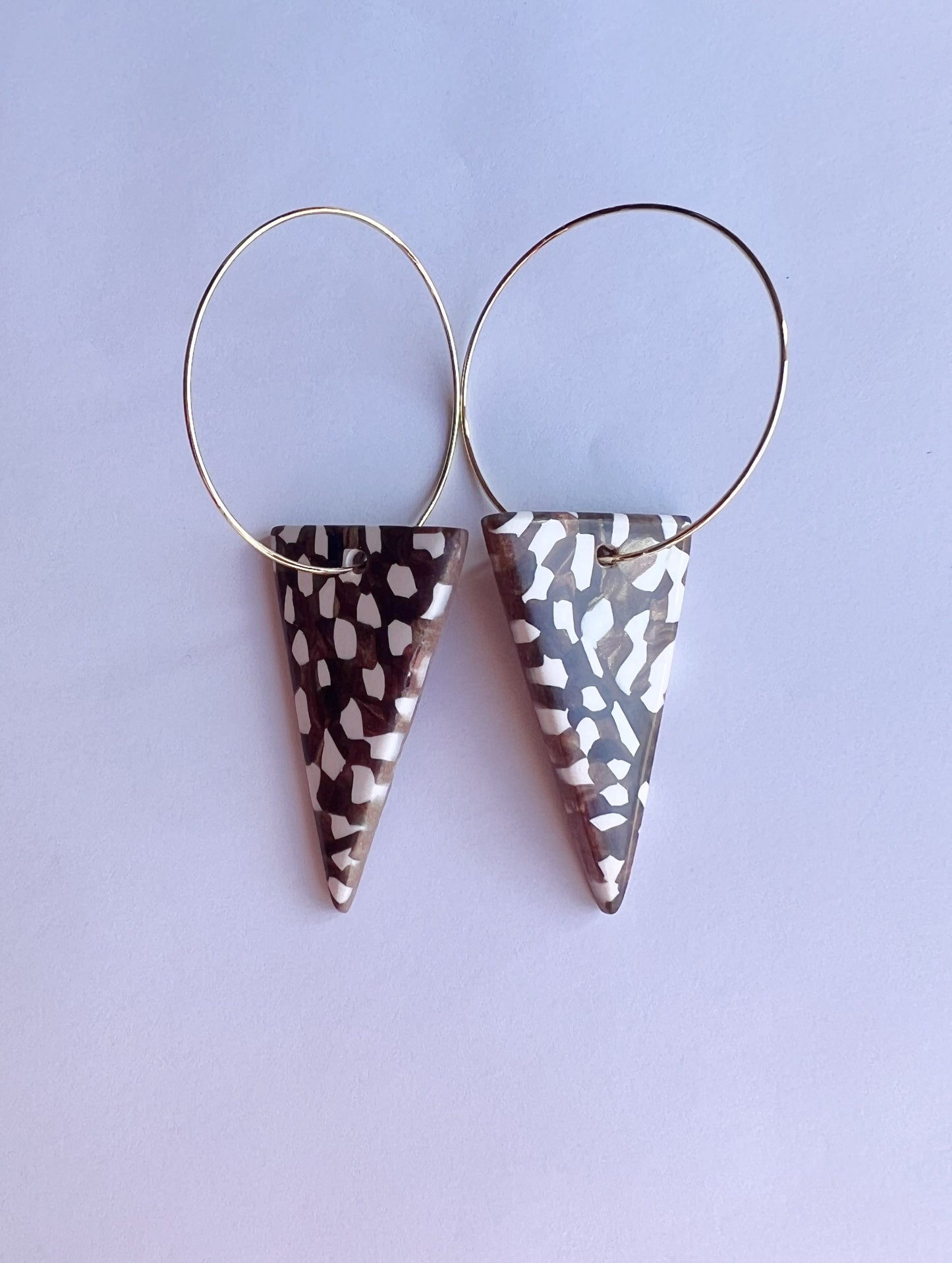 The Taper Earring in bronze and cream
