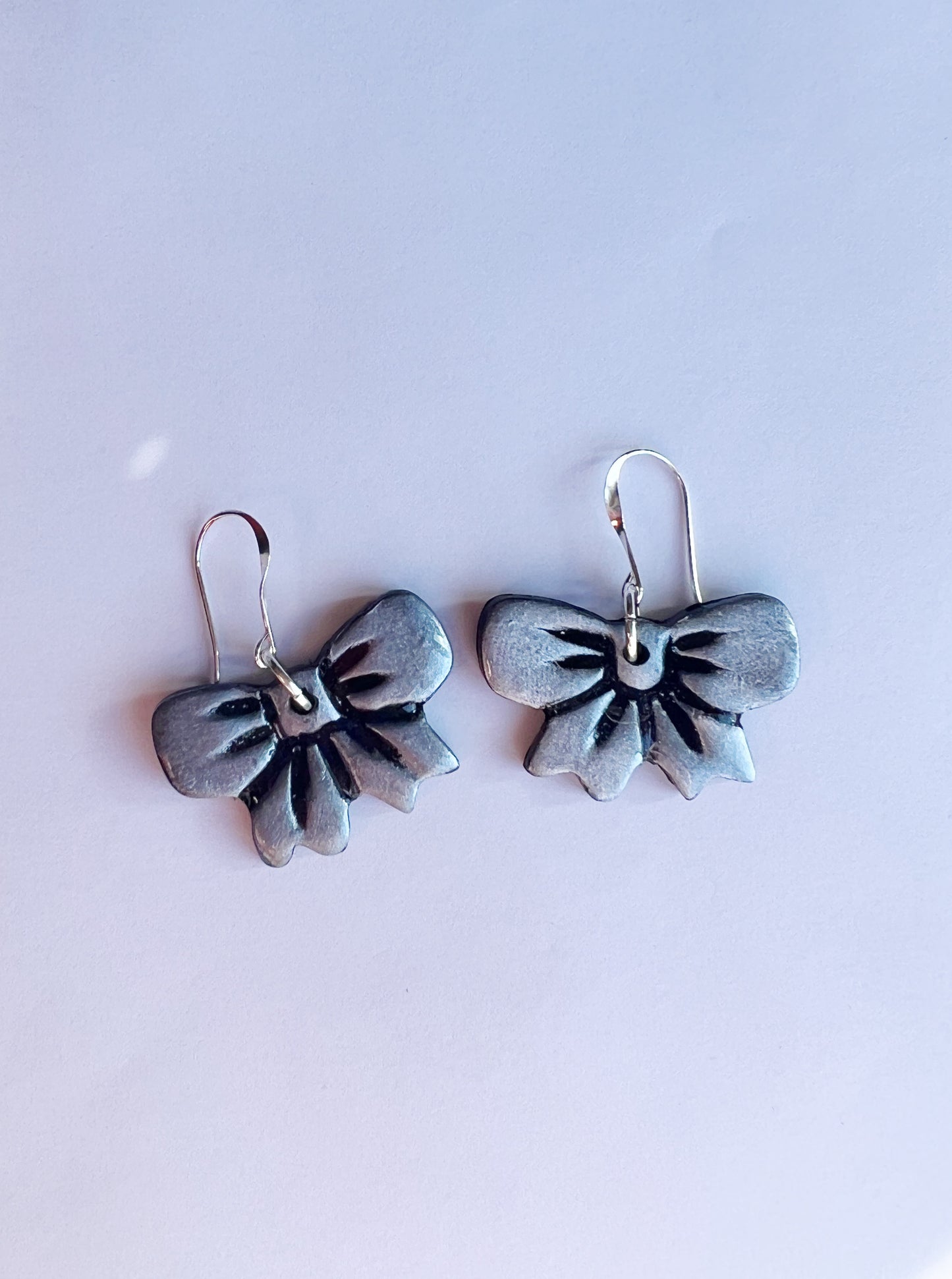 The Darling Earring in silver and black